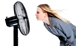 hair blowing in a breeze from a fan